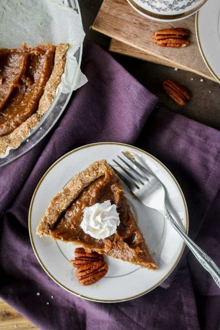 Easy date caramel pecan pie slice on a plate, seen from the top