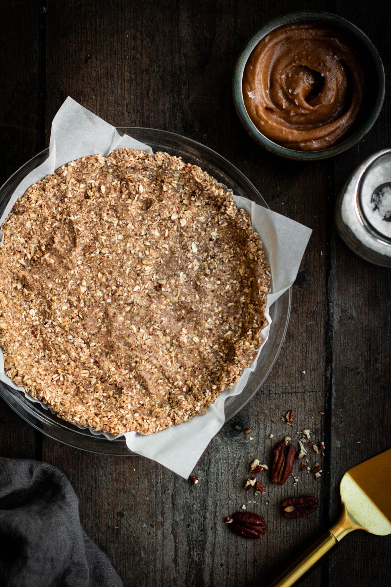 Oat and pecan crust in a dish, seen from the top