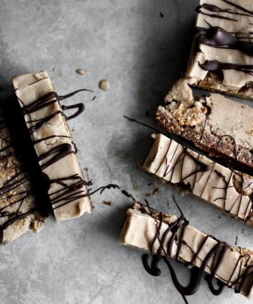 Brownie Cookie Dough "Ice Cream" Bars seen from overhead with chocolate drizzle