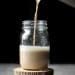 cashew dirty chai latte poured in a mason jar
