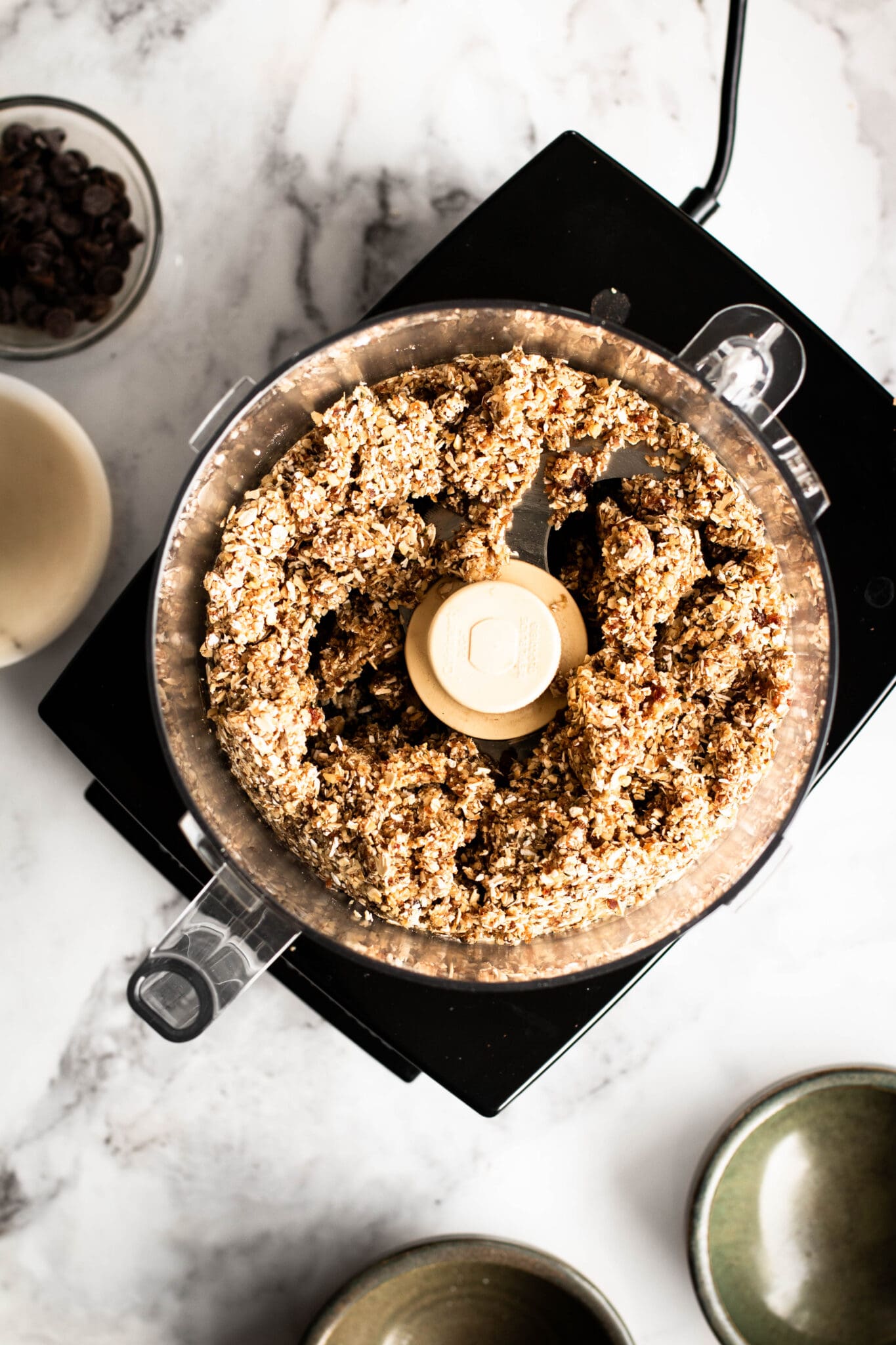 Granola bar mixture in a food processor, seen from the top