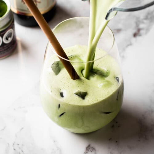 matcha latte poured in a glass with ice