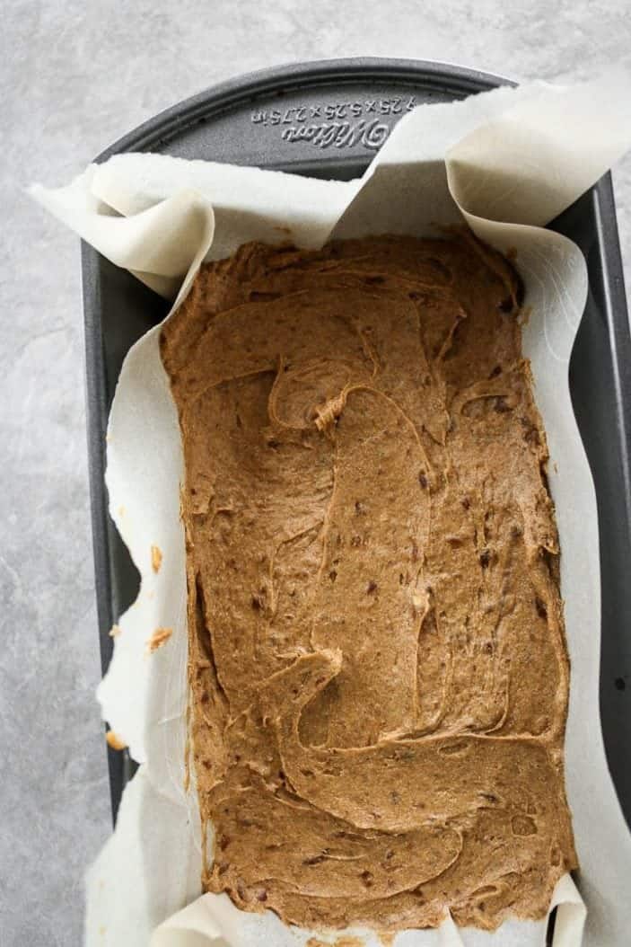 pumpkin bread batter in a loaf pan