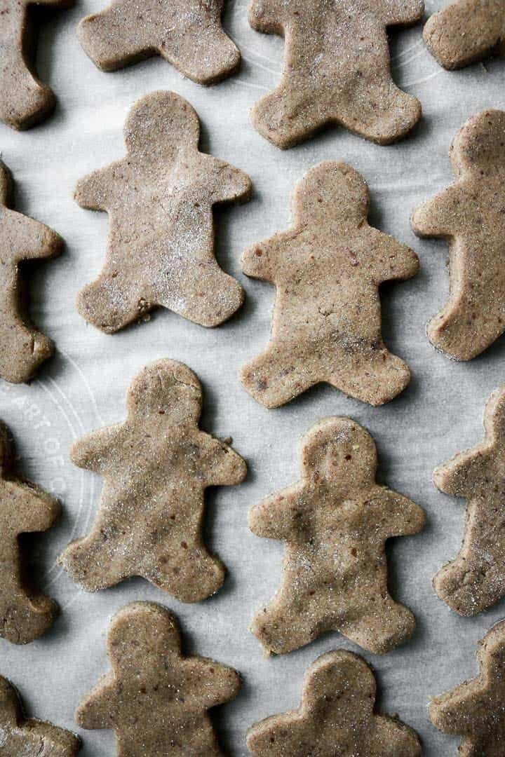 Chai-Spiced Cut-Out Cookies shaped as gingerbread men seen from the top.