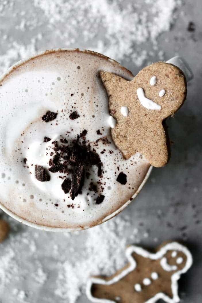 Creamy Sugar-Free Hot Chocolate seen from the top with a gingerbread man in the cup.