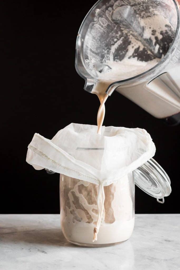 eggnog poured into a nut milk bag