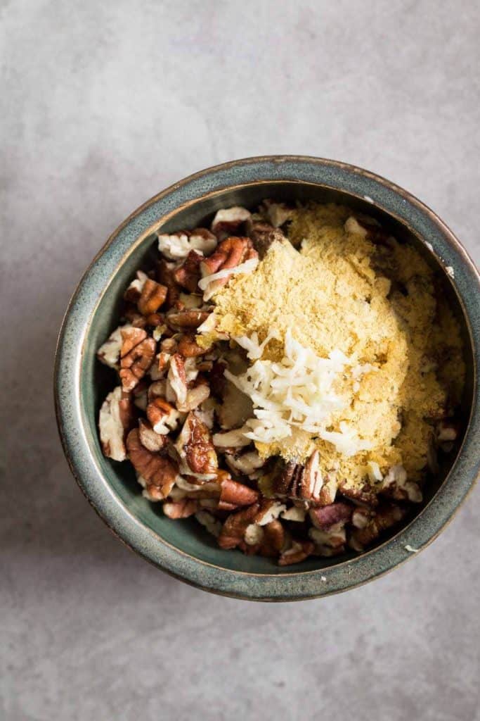 pecans, garlic and nutritional yeast in a bowl