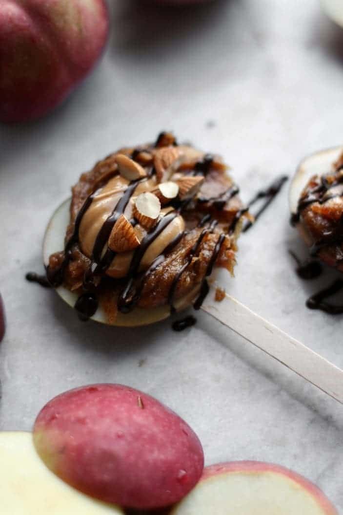 apple slice with date caramel, peanut butter and chocolate