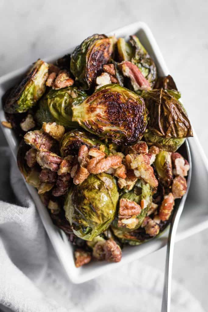roasted brussels sprouts with pecan parmesan in a dish