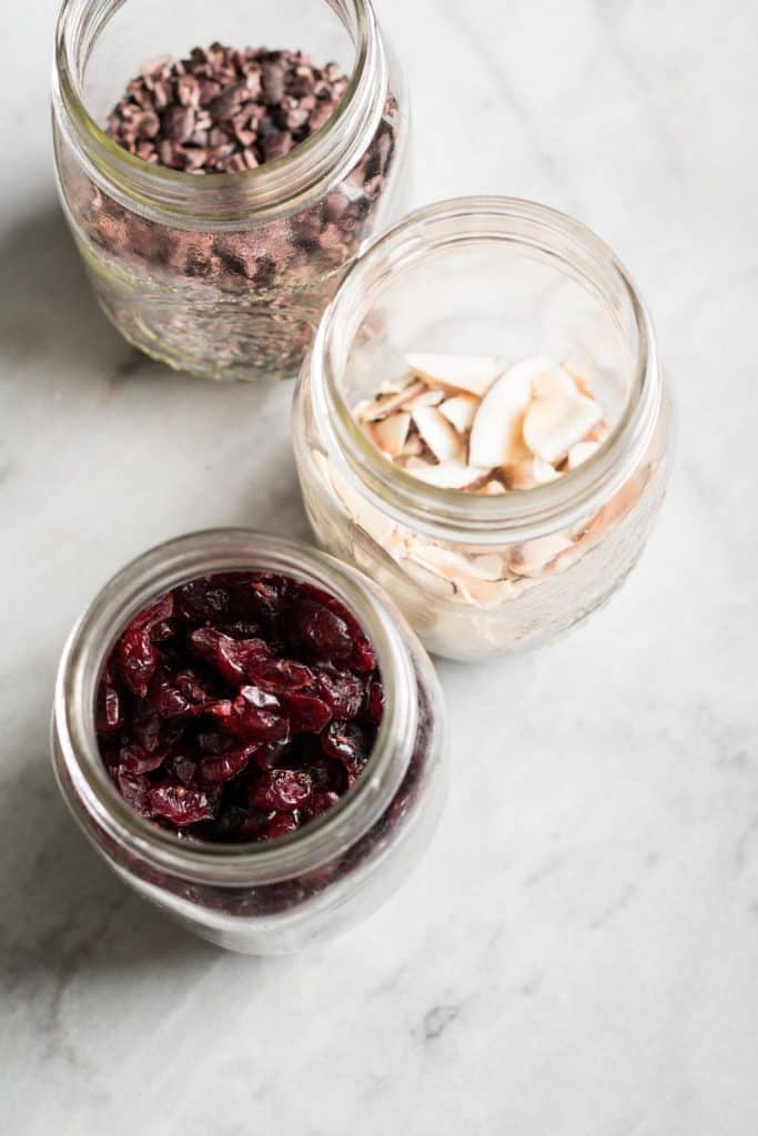 jars with dried fruits, cacao nibs and coconut