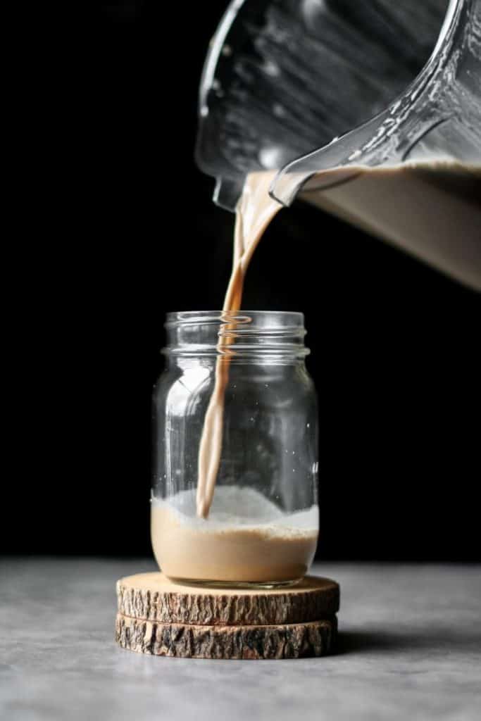 Cashew Dirty Chai Latte poured in a mason jar