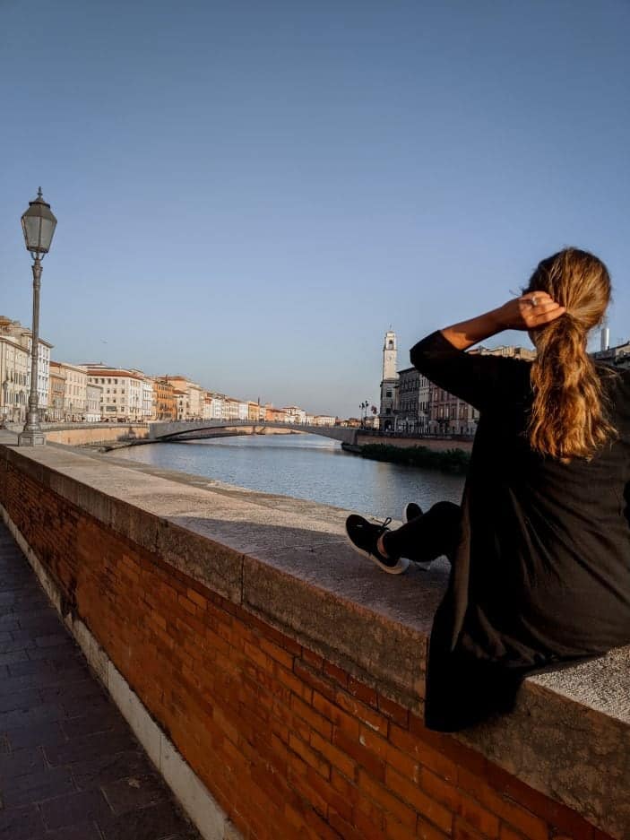 Tuscany Road Trip - girl sitting by river