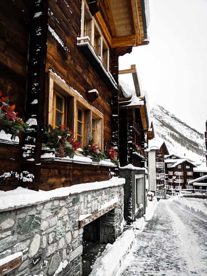 wooden building in snow