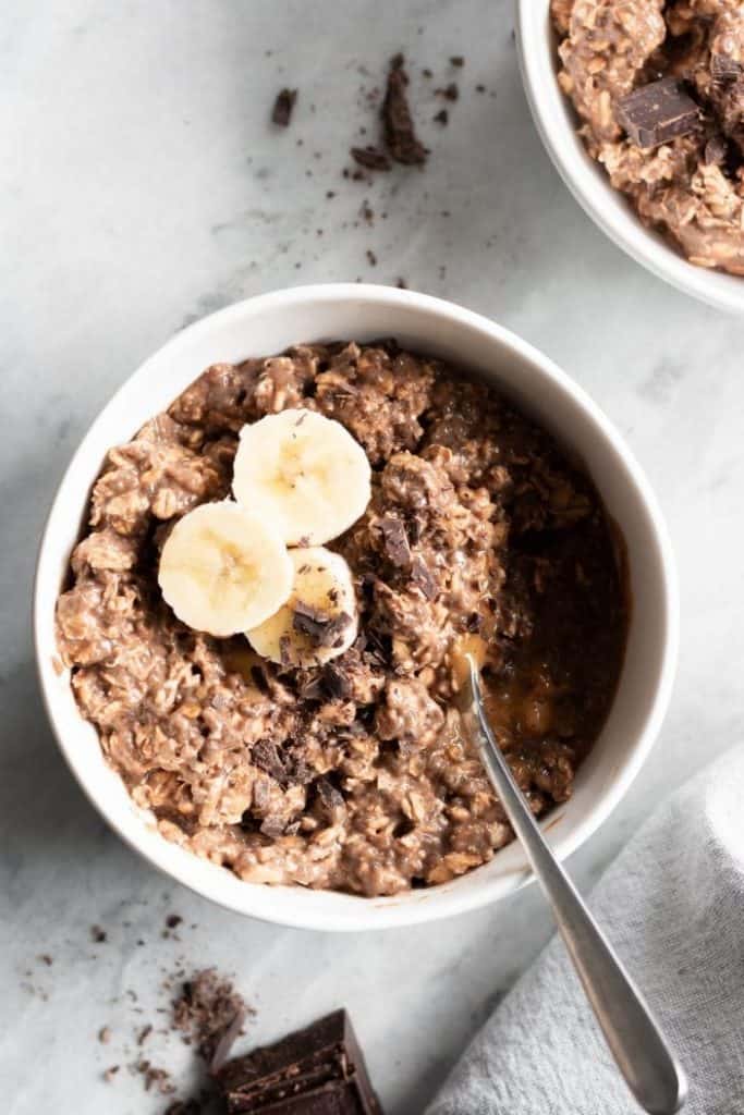 Chocolate Hazelnut Overnight Oats with bananas in a bowl