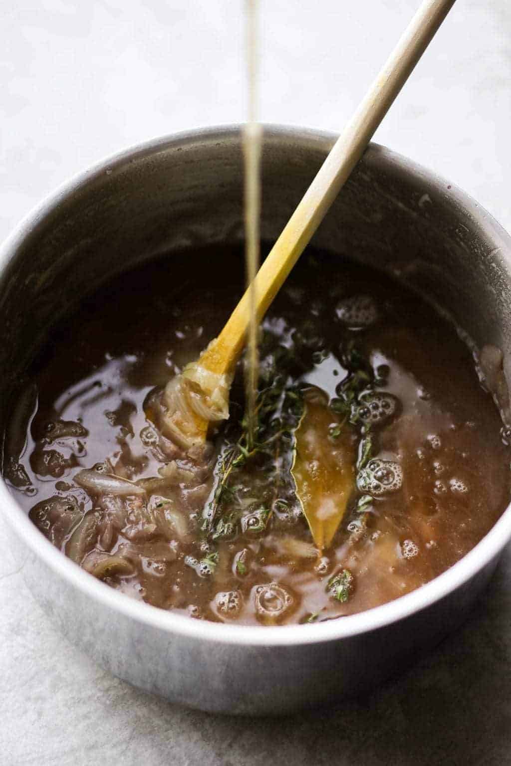 Vegetarian French Onion Soup in a saucepan