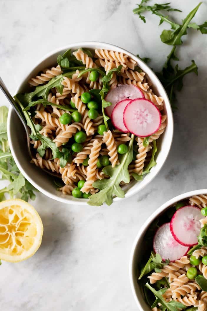 arugula pasta salad in a bowl