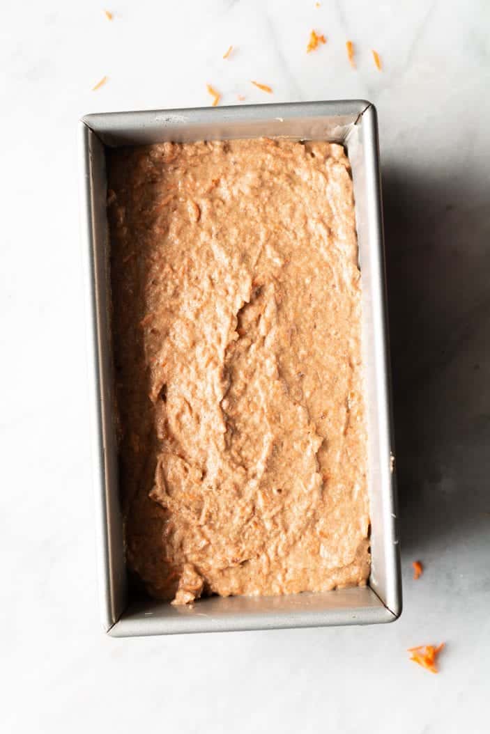 unbaked carrot cake in a loaf pan