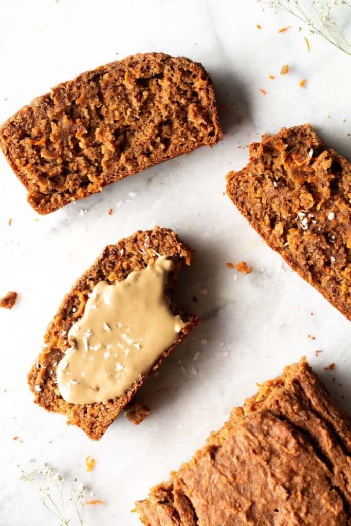 slices of fruit-sweetened carrot cake loaf with sunflower seed butter