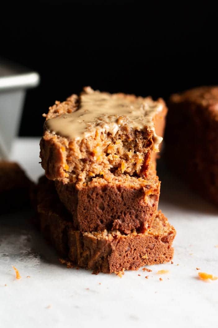 carrot cake loaf sliced and served with sunflower seed butter