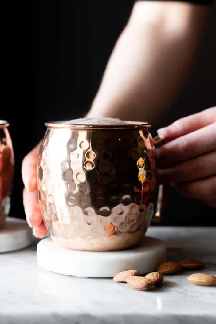 hands holding hot cocoa mug