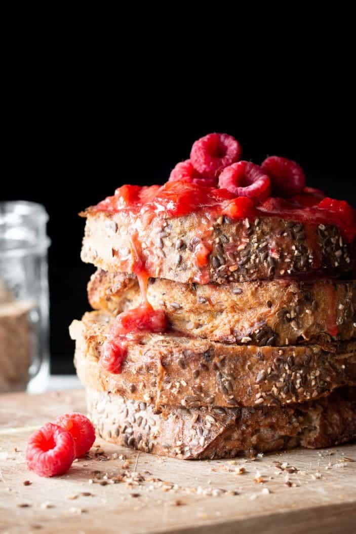 stack of french toast with raspberries