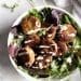basic falafels in a bowl of greens
