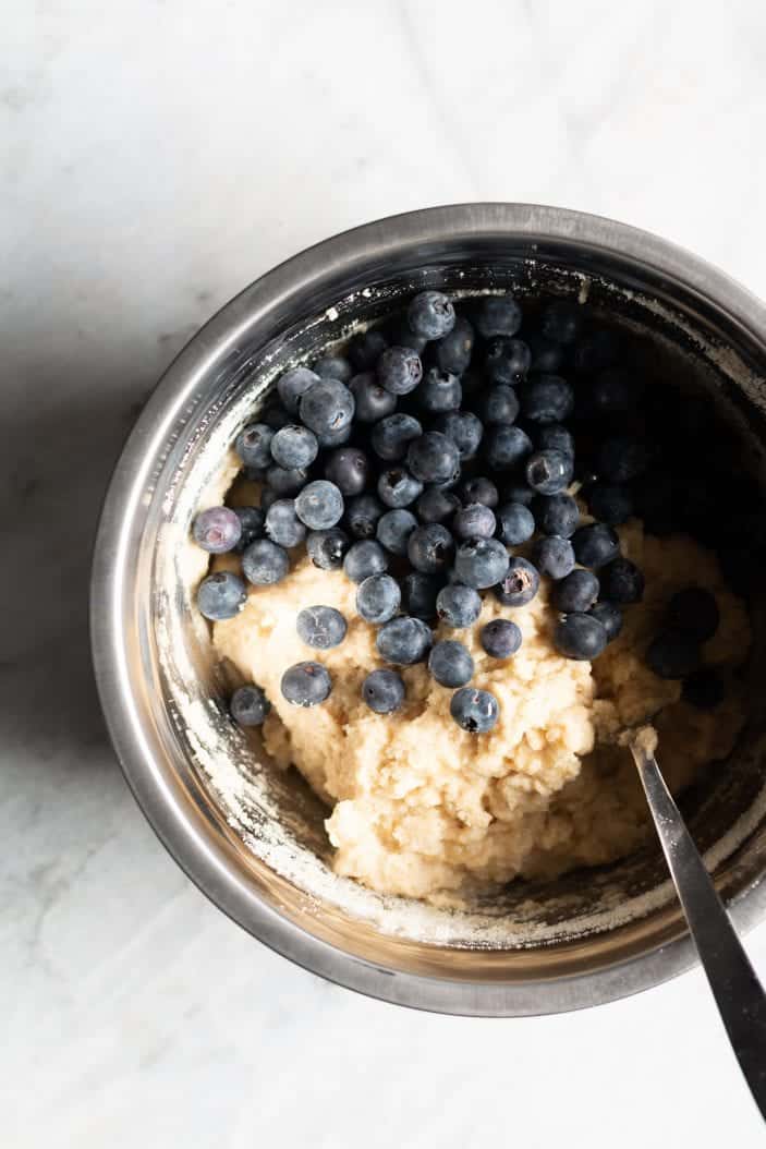 blueberry banana almond flour muffins mixture in a bowl