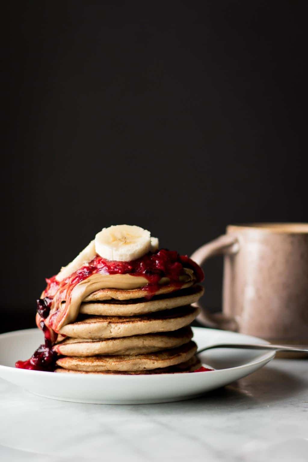 Banana Oatmeal Blender Pancakes with Berry Compote