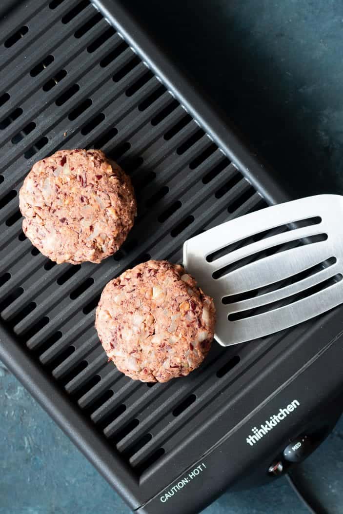 grillable walnut veggie burger on a grill