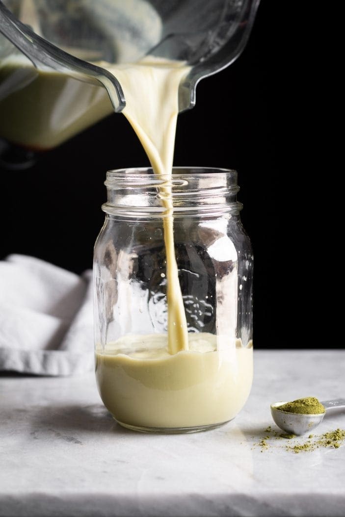 Iced Almond Matcha Latte poured in jar
