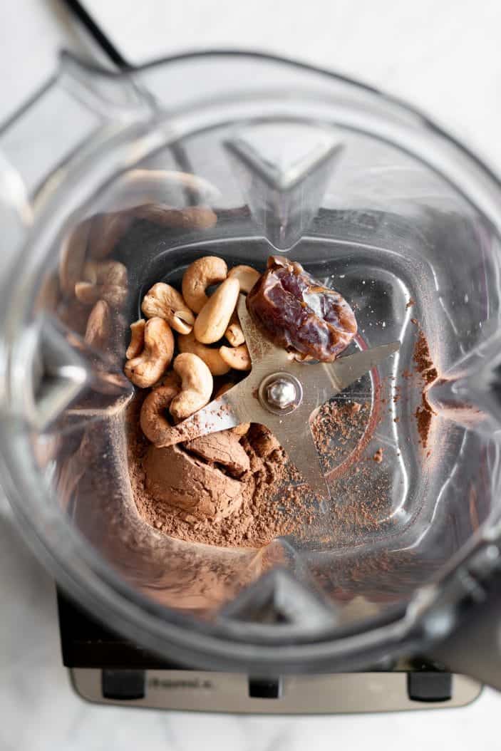 cashews, dates and cocoa powder in blender