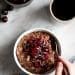 chocolate oatmeal in bowl with cherries