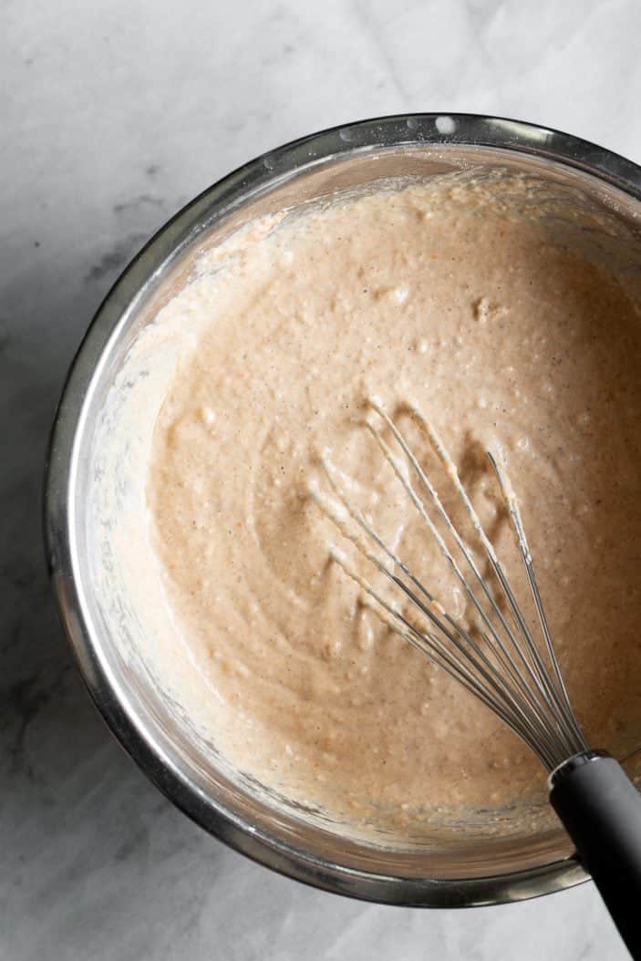 waffle batter in bowl with whisk