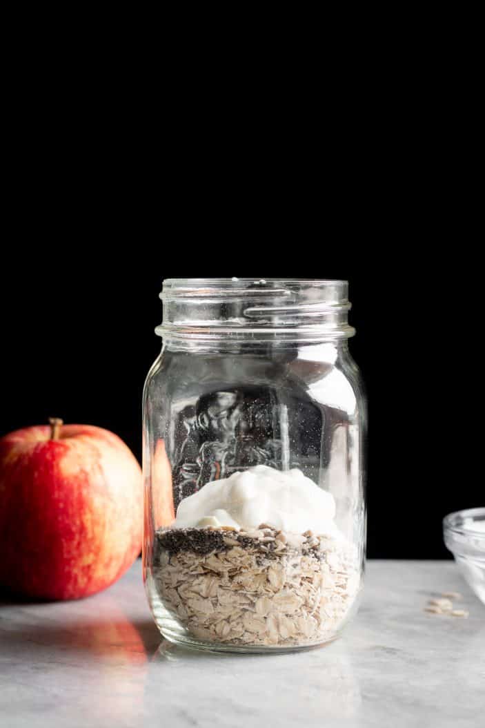 Protein Apple Muesli ingredients in a jar from the side