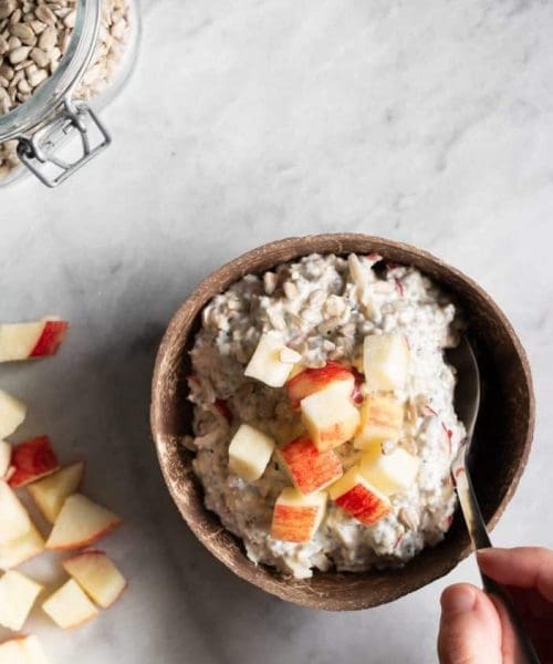 apple muesli in a bowl from top