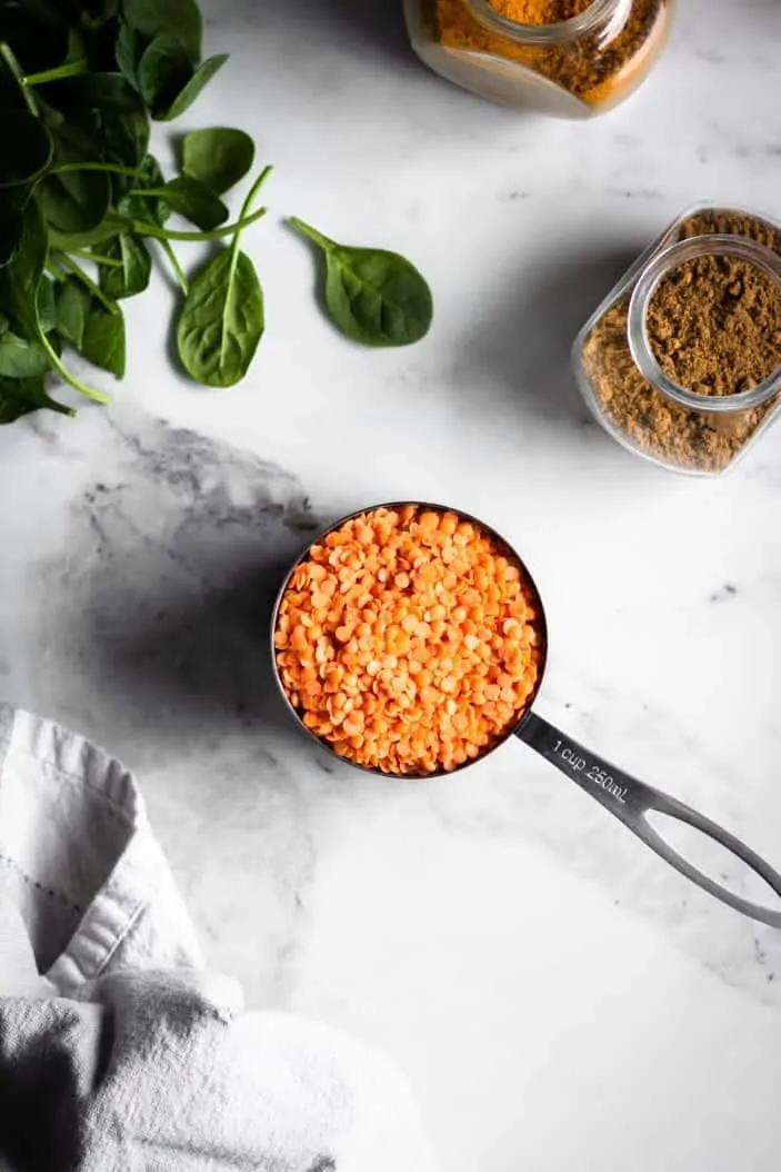 red lentils in measuring cup
