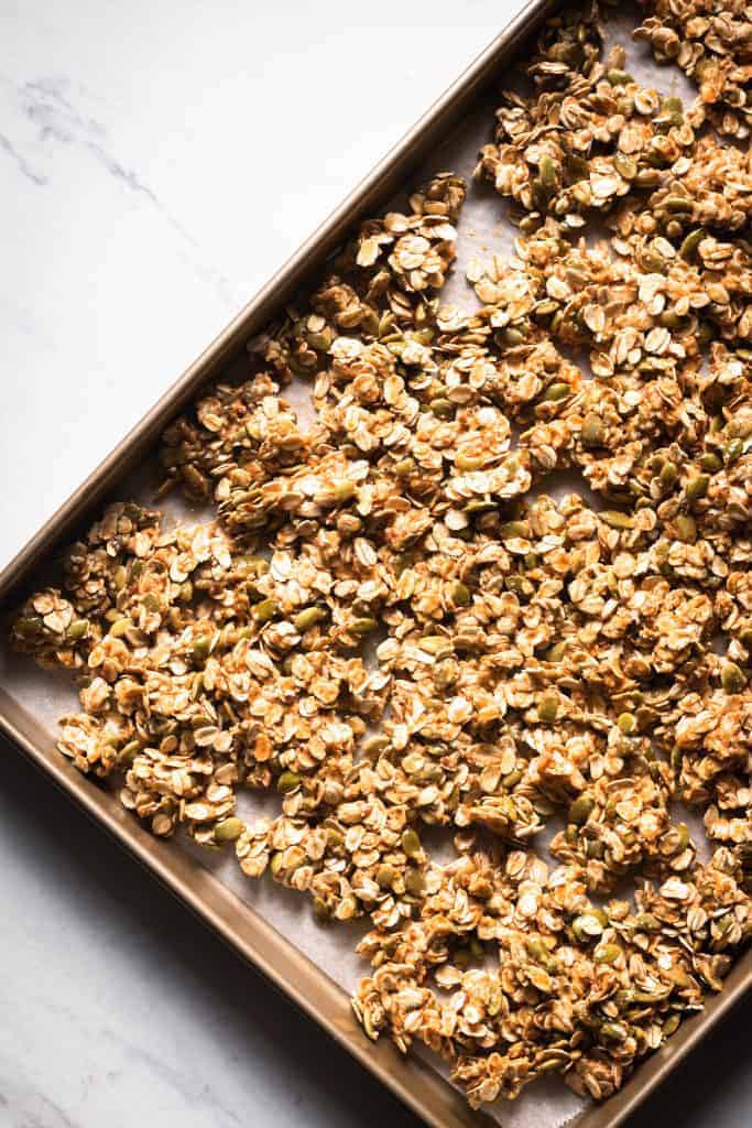 granola mixture on a baking sheet