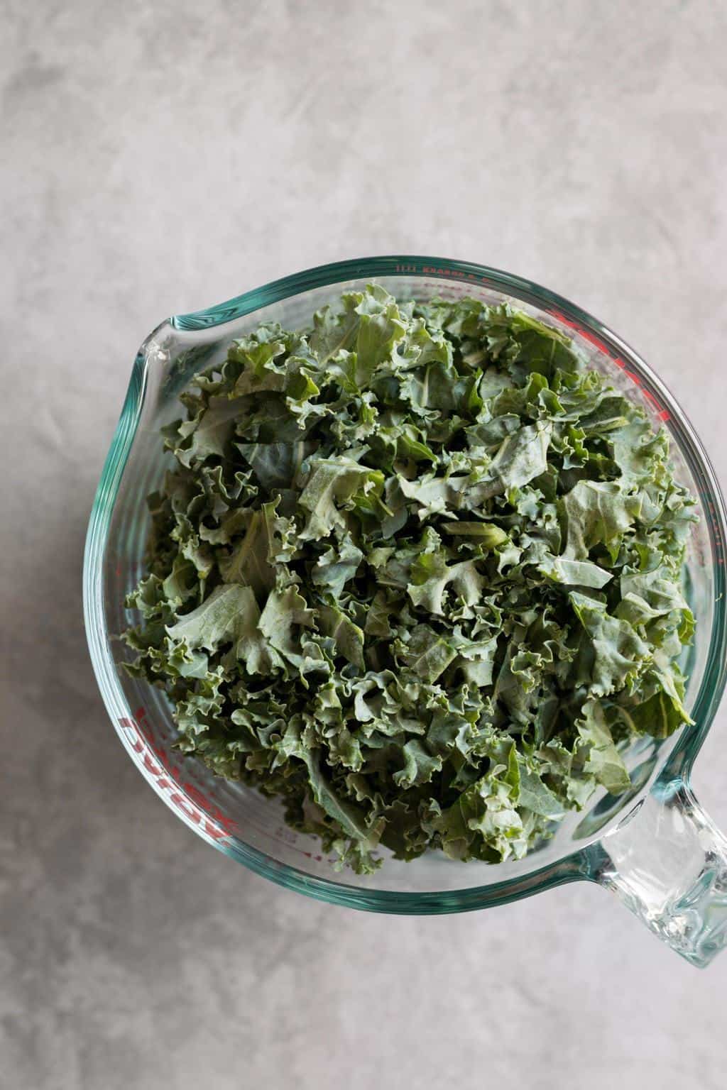 kale in a measuring cup