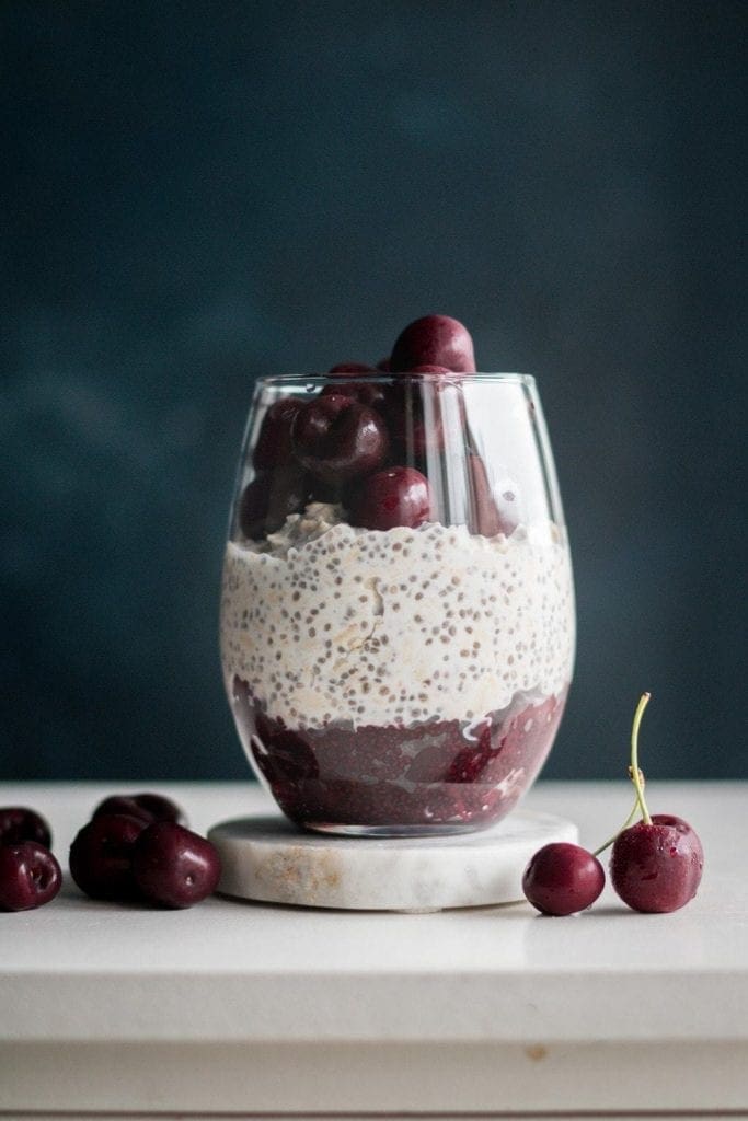 cherry coconut overnight oats in a glass