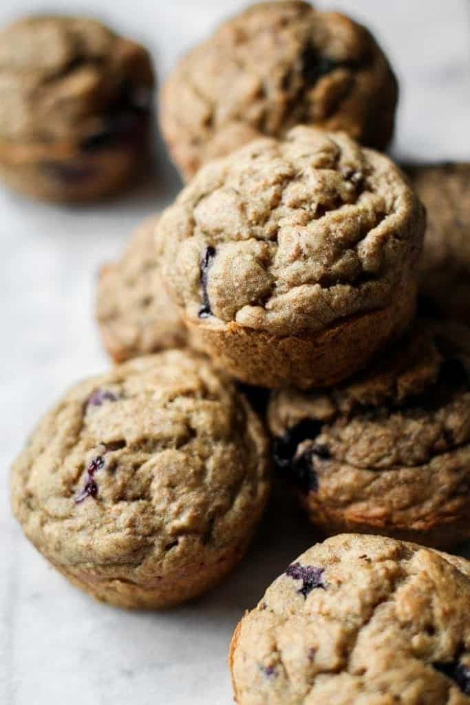 blueberry cardamom muffins in a pile