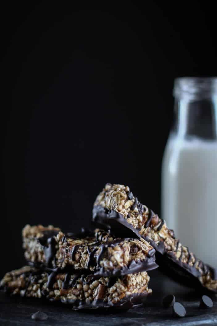 Three Chocolate Pretzel Quinoa Bars on top of each other seen from the side.