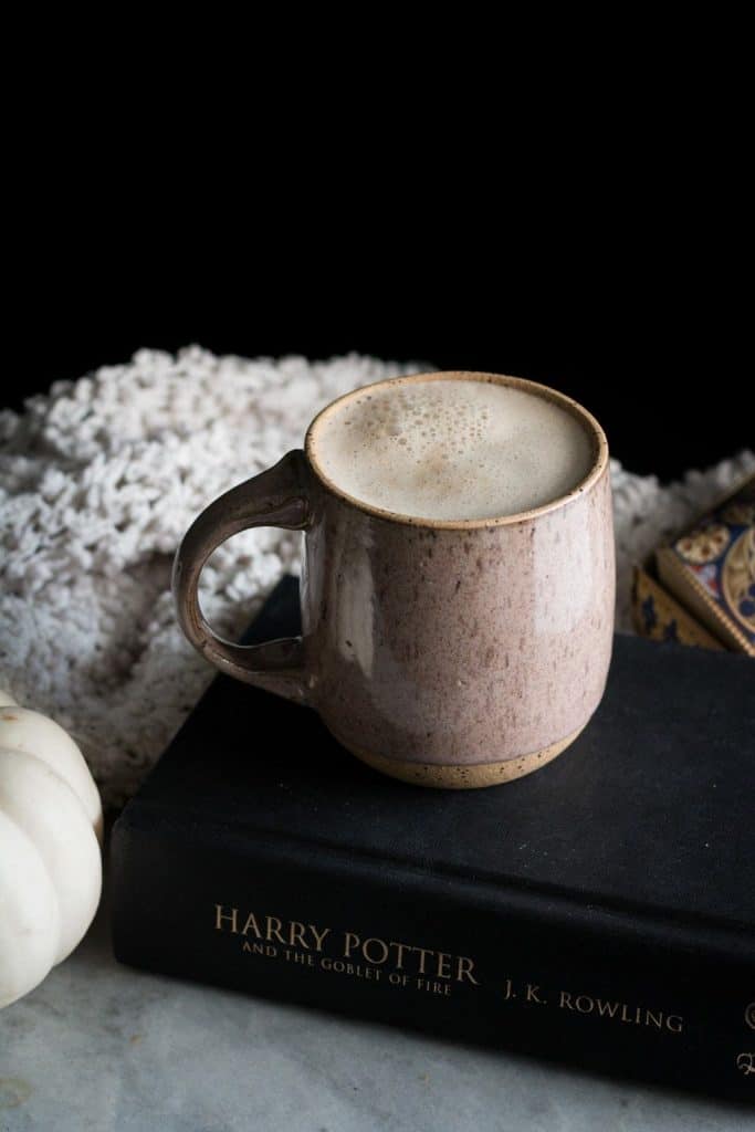 latte in a mug on a book