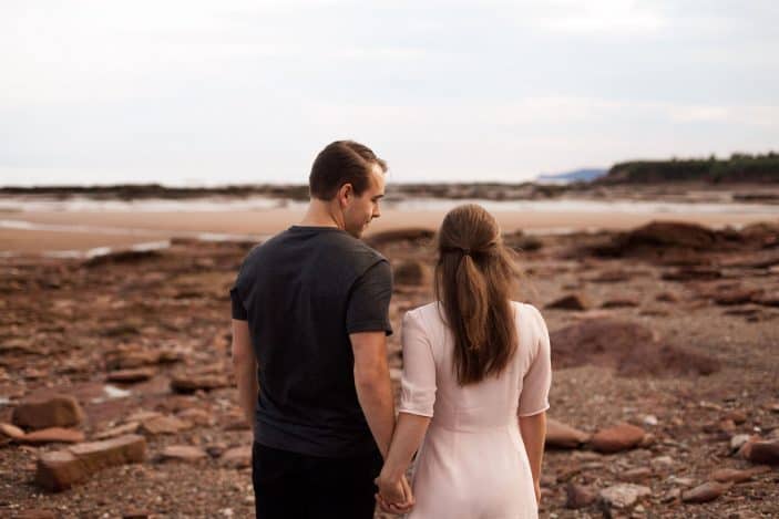 couple holding hands - engagement photos
