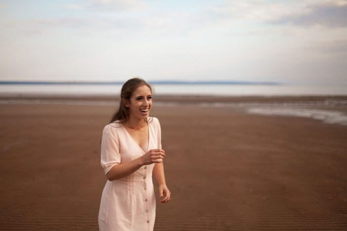 What I eat in a day - girl smiling on beach