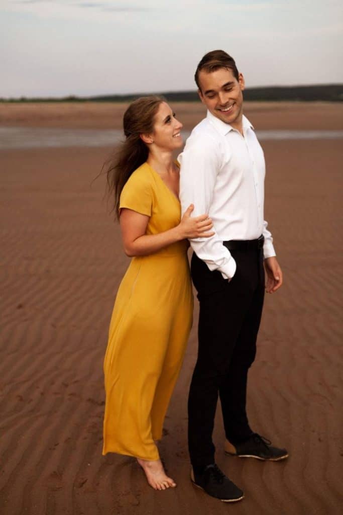 girl holding guys arm - engagement photos