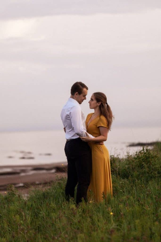 couple hugging in the tall grass