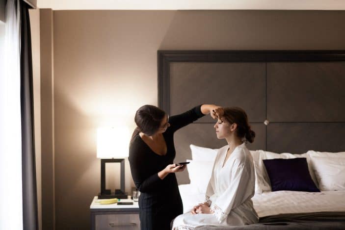 bride getting makeup done