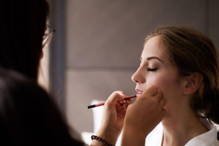 bride getting makeup done