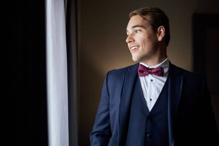 groom looking out the window