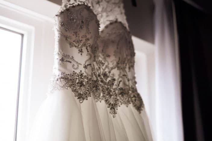 bride's dress in front of window